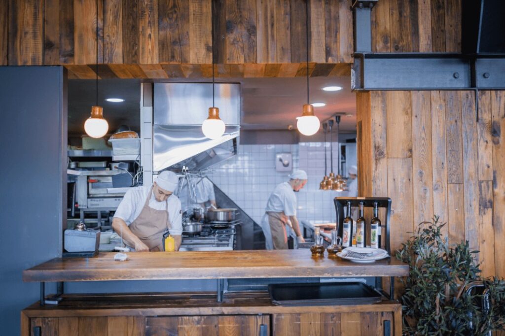 Small restaurant with a clean environment and two employees and wood surround - Idaho Falls Commercial Construction Apollo Construction Company Inc.