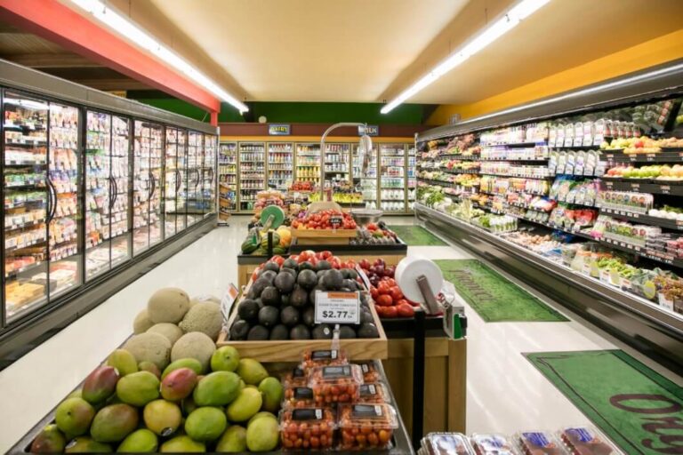 Grocery store of fresh fruit in the center isle and full shelves on the sides after completion by Idaho Falls Commercial Construction Apollo Construction Company Inc.