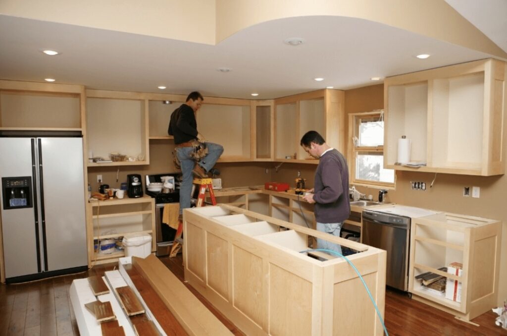 Kitchen remodel in progress with partially finished cabinets and center island - Idaho Falls Residential Construction Apollo Construction Company Inc.