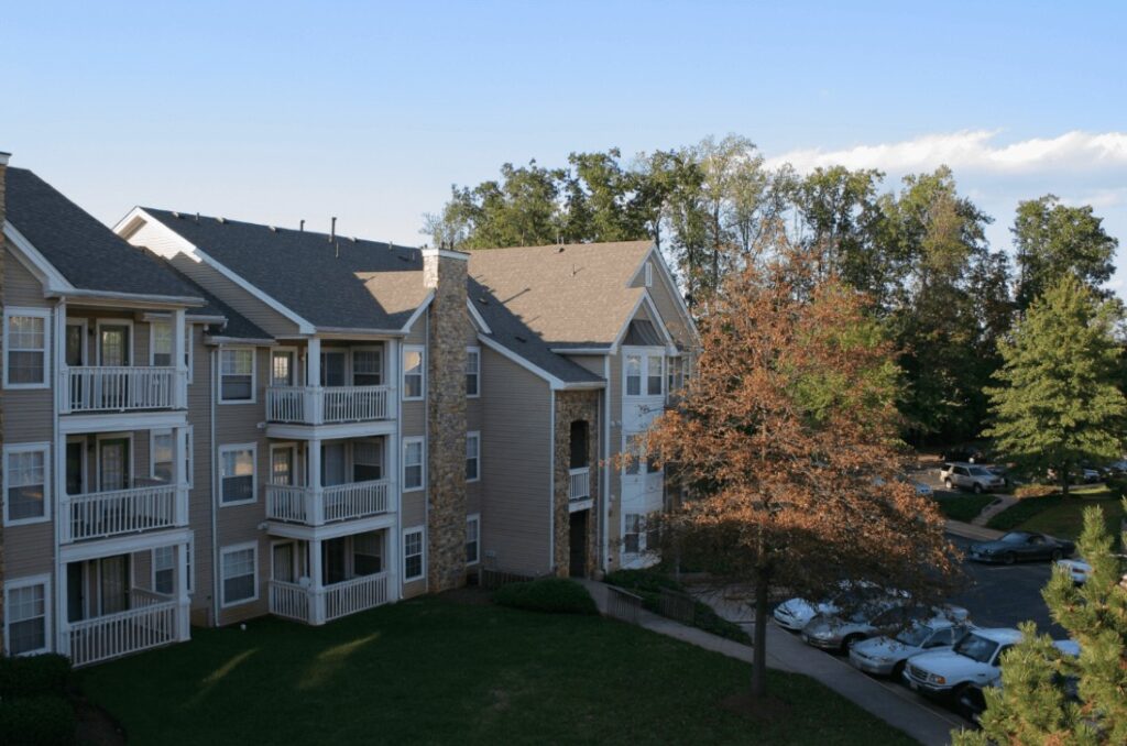 Large multi-story apartment building with balconies and trees completed by Idaho Falls Residential Construction Apollo Construction Company Inc.