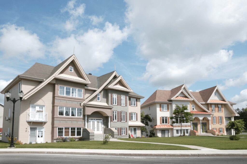 Two finished multi-family apartments with brown and peach accents by Idaho Falls Residential Construction Apollo Construction Company Inc.